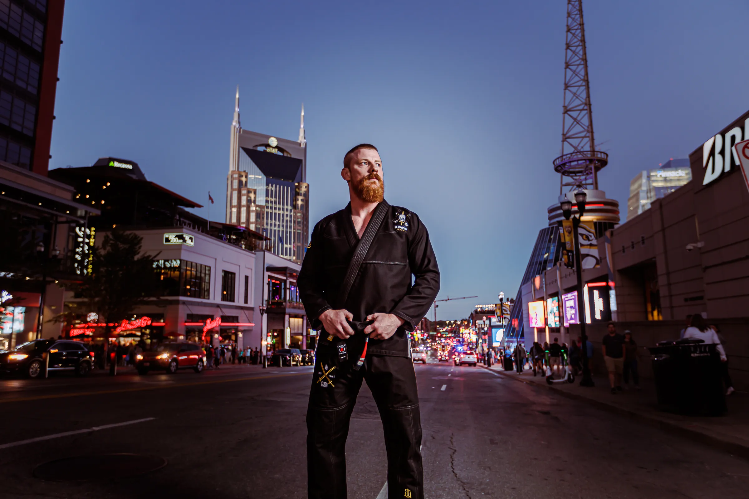 A practitioner in a city at dusk